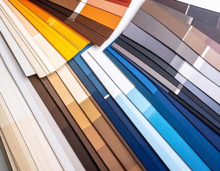 Vibrant tableau unfolds with flat lay of colorful paper samples showcasing spectrum of hues, from warm tones to cool shades, creating artistic display photo