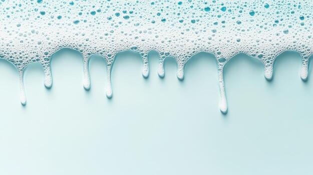 White foamy bubbles with liquid dripping down on a light blue background, smooth surface, clean appearance. photo
