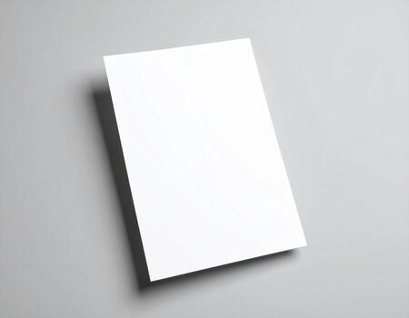 Blank white paper on a gray background photo