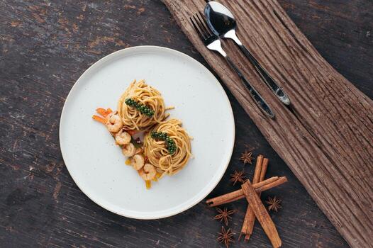 Overhead View of Shrimp Scampi Pasta on Rustic Background photo