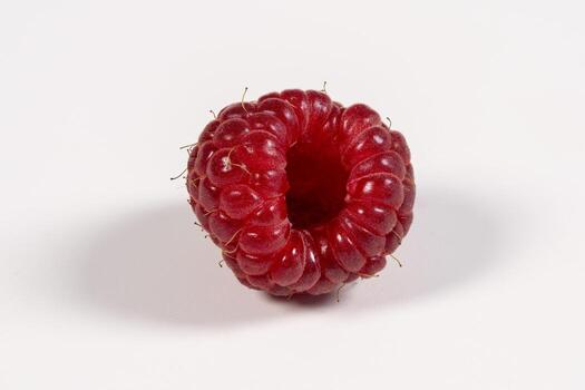 Unique Twisted Raspberry Showcasing Vibrant Red Color and Texture photo