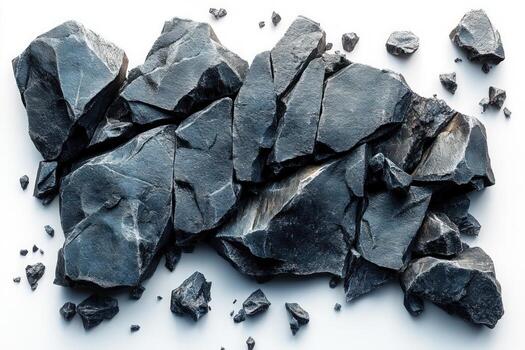 A group of grey rocks on a white background. The rocks are of varying sizes and shapes and are arranged in a random pattern. photo