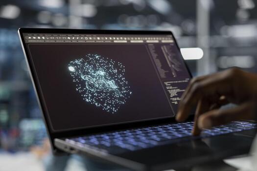Close up of data center technician using laptop, running AI forecasting simulations, tracking performance. Server hub IT specialist uses notebook to integrate artificial intelligence API into software photo