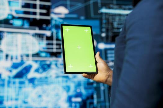 Black IT engineer analyzing algorithmic data next to copy space, uses devices surrounded by futuristic digital visuals. AI smart technology and neural networks in a high tech environment. photo