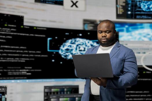 African american professional engineer programming for innovation hub, reviewing big data and binary code on the dashboard. IT developer working on programming language algorithm. photo