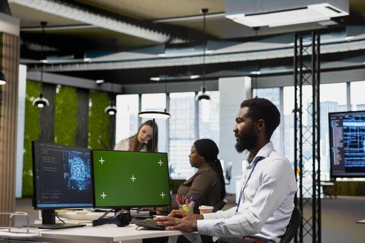 Admin using mockup PC to adjust machine learning algorithms parameters, automating workflow. Tech company worker using AI insights for code optimization on green screen computer photo