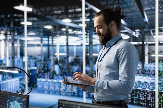 Programmer working in server farm with hardware supporting advanced analytics tasks and data mining. Data center IT expert doing maintenance on racks storing blockchain records photo