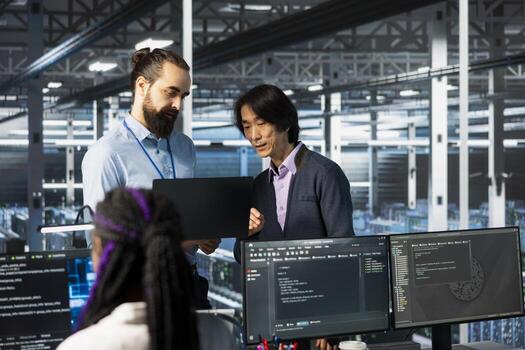 Server farm IT employees deploying AI tools to automate repetitive workflows. Data center software developers managing large datasets used in AI training procedures to streamline tasks photo