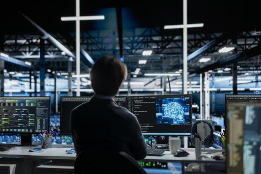 Server room IT worker deploying AI tools to automate repetitive workflows. Data center programmer managing large datasets used in AI training procedures to streamline tasks photo