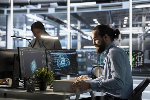 Admin in data center packing desk belongings after being replaced by AI automation handling infrastructure operations. Employee suffering from workforce displacement by artificial intelligence photo