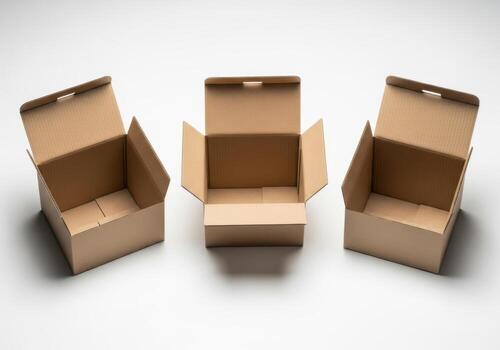 Three open cardboard boxes arranged on a white background photo