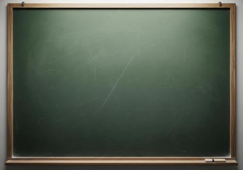 Empty green chalkboard with wooden frame and chalk piece photo