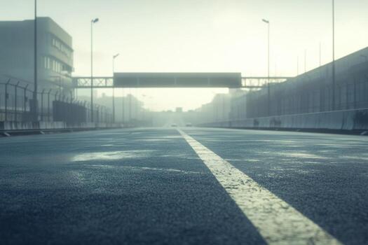 An empty road with a traffic light in the middle photo