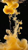 Dynamic liquid art with vibrant yellow ink flowing, creating abstract shapes on black backdrop video