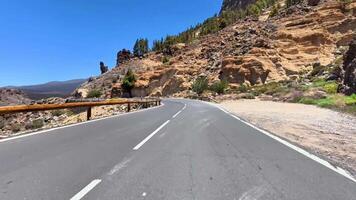 a road with a mountain on one side and a road the other video