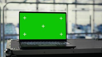 Green screen notebook in data center training infrastructure for artificial intelligence workloads. Mockup laptop in server room enabling machine learning training and inference video