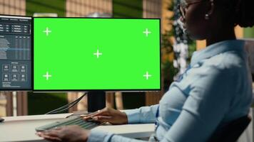 Equity analyst using isolated screen PC to reviews quarterly earnings, assessing stock exchange performance. Trader conducts financial analysis using chroma key PC to improve investments, camera B video