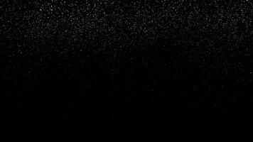 Abstract dynamic falling golden glitter particles and dots. Rain of golden glitter particles on black background. animation of shimmering dust and shiny dots. seamless loop video