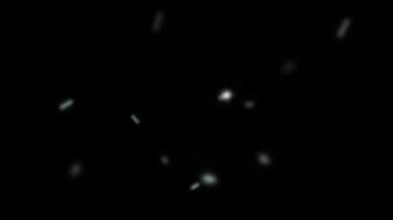 Abstract glowing bokeh lights create a dynamic, swirling pattern with warm orange and yellow hues against a dark background. video