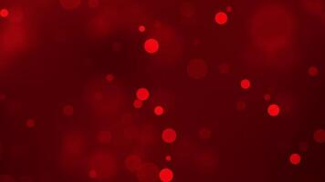 Dark red background with glowing bokeh circles and soft blur video