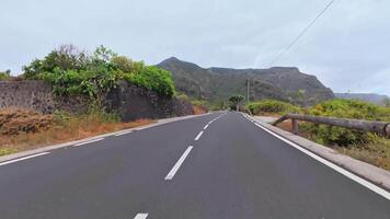 Immerse yourself in the captivating beauty of a meandering road, framed by nature and tranquil landscapes photo
