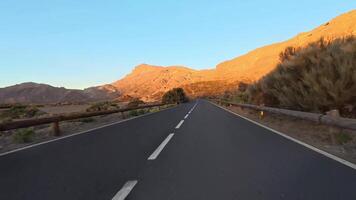 The beautiful and scenic mountain road at sunset presents a stunning visual vista photo