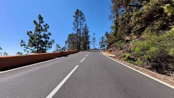 The Serene Mountain Road boasts Scenic Views and Clear Blue Skies for all to enjoy photo