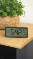 Clock display shows time and date in a cozy setting video