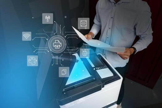 Man operates a multifunction printer in a modern office environment while using technology for document management photo