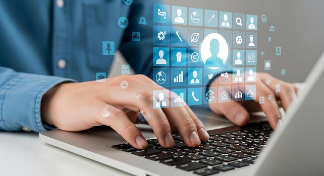 Close-up of hands typing on a laptop keyboard with glowing digital data and network connections overlay photo