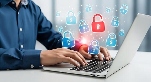 Man using laptop with glowing digital security icons representing cybersecurity and data protection technology for online safety photo