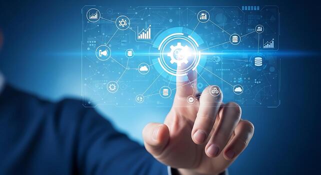 Hand interacting with futuristic digital interface glowing with technology icons and data visualizations in a blue illuminated environment photo