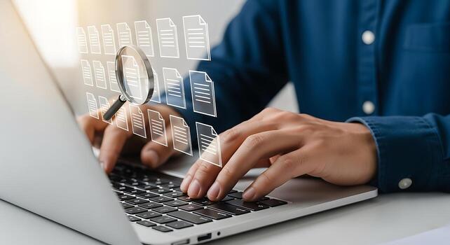 Close-up of a person's hands typing on a laptop keyboard with a subtle overlay of digital data and glowing lines suggesting technology and business photo