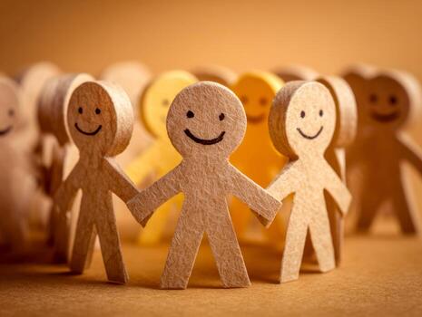 Smiling paper cutouts forming a supportive circle representing unity and kindness photo