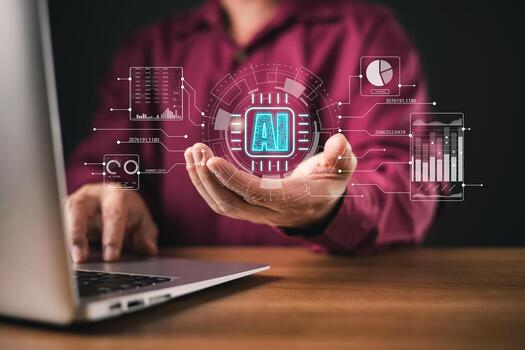 A person interacts with a laptop while holding a virtual AI interface featuring data charts, analytics, and futuristic graphics, representing artificial intelligence and machine learning technology. photo