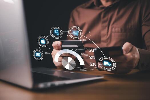 A person using a smartphone and holding a credit card conducts online shopping while monitoring credit score and payment transactions, with digital icons and analytics overlaying the scene. photo