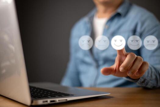 A person interacts with a digital rating system, selecting a glowing happy face emoji on a virtual interface, symbolizing customer satisfaction, feedback, service review, and user experience. photo