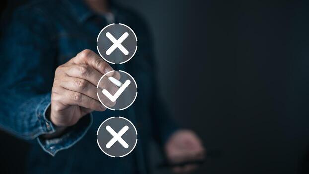 A person selects a glowing checkmark from a vertical list of choices displayed as icons with two crosses and one tick, symbolizing decision making, options, and choosing the correct path. photo