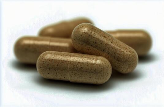 Capsules Resting on a Flat Surface With a Focus on Their Textured Appearance and Natural Color photo