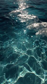 Reflective Ocean Surface With Shimmering Light During Midday in a Tranquil Sea photo