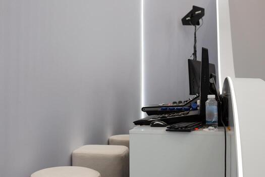 Sound equipment and light control setup in minimalist workspace. Modern design with focus on technology and audio visual systems, ideal for creative and professional environments photo
