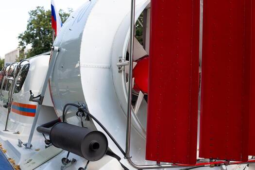 The rear part of the hovercraft rescue boat with large propeller screw for gaining speed and guides for turning. The fan on rear part of the boat as element for gaining speed. Unusual transport photo