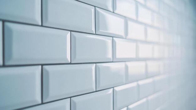 White glossy subway tiles create a modern and sleek interior design for homes and commercial spaces during daylight photo