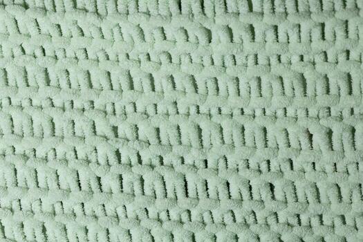 Soft Green Textured Fabric With Intricate Woven Pattern Suitable for Various Applications photo