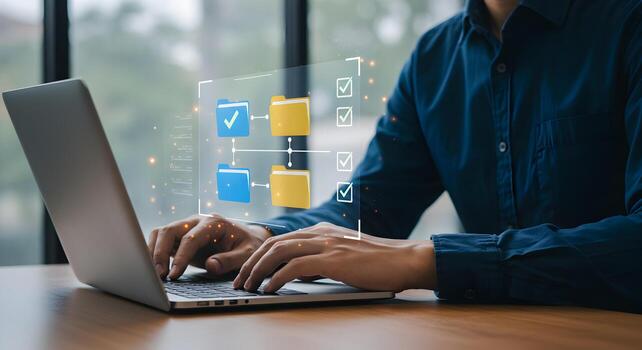 Data management system concept man using laptop for file transfer and document management workflow automation photo