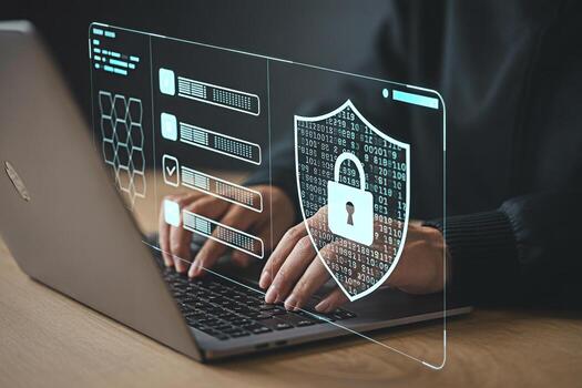 Cybersecurity concept person using laptop with digital security shield and data protection overlay photo