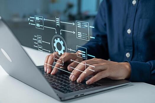 Automation software development process engineer working on laptop for workflow optimization task flow diagram photo