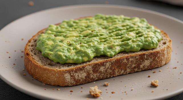 Avocado Toast with Bread Crumb on Plate photo
