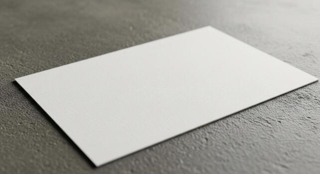 Blank White Card on Textured Gray Surface photo