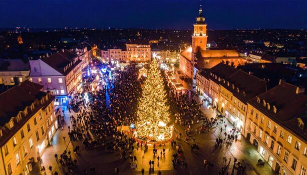Lively Christmas market at night, featuring magnificent illuminated tree and bustling crowds, creating wonderful festive atmosphere. charming cityscape shines with holiday cheer photo